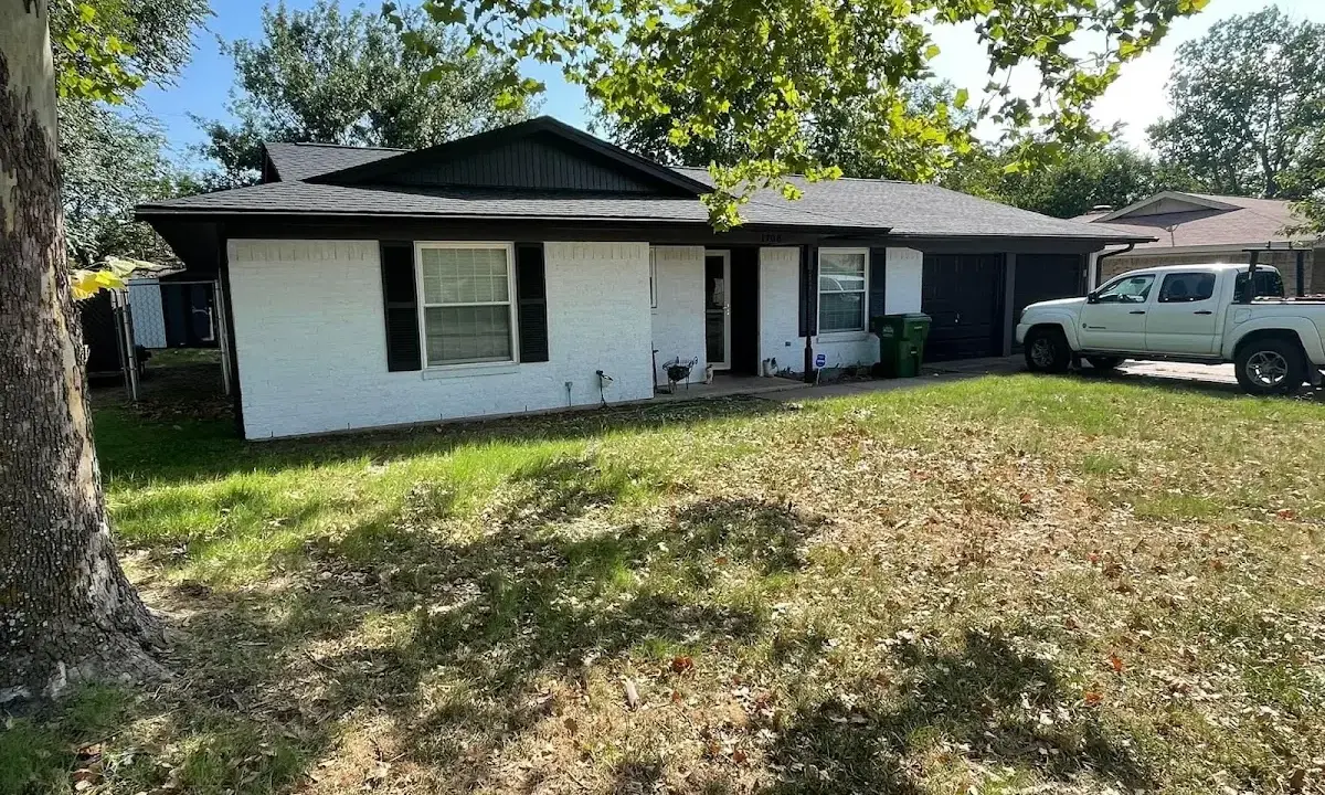 Professional roofing crew working on a residential roof in Battle Creek